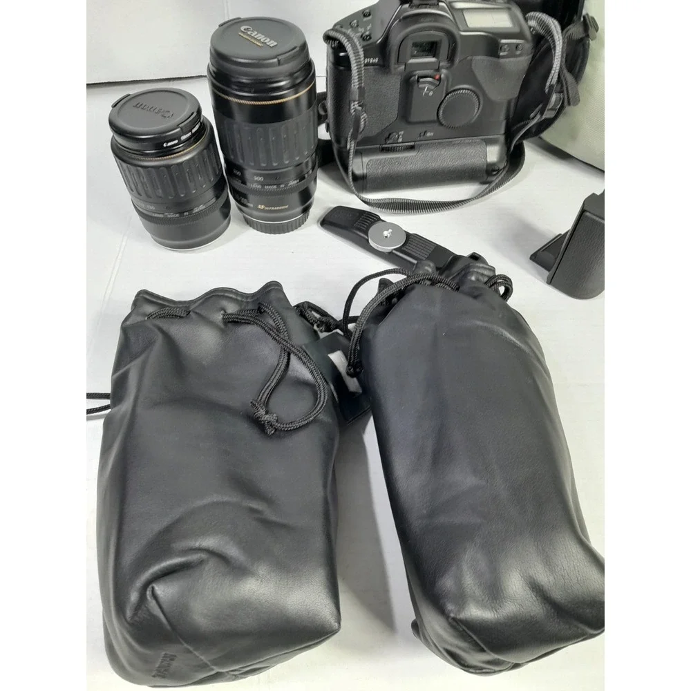 Vtg Canon EOS-1N RS 35mm SLR Film Camera W Accessories 2 Lens Grip Light Bag